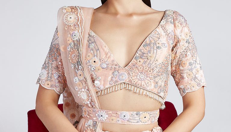 Mesmerizing in Peach: The Organza Lehenga Choli Set with Exquisite Embellishments