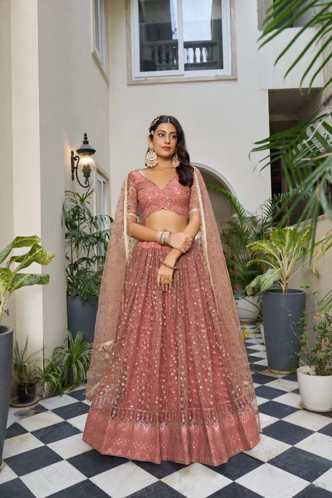 Rust Butterfly Net Lehenga: A Perfect Blend of Elegance and Glamour for Every Occasion 1 Rust Butterfly Net Lehenga with Tone-to-Tone Embroidery and Sequins